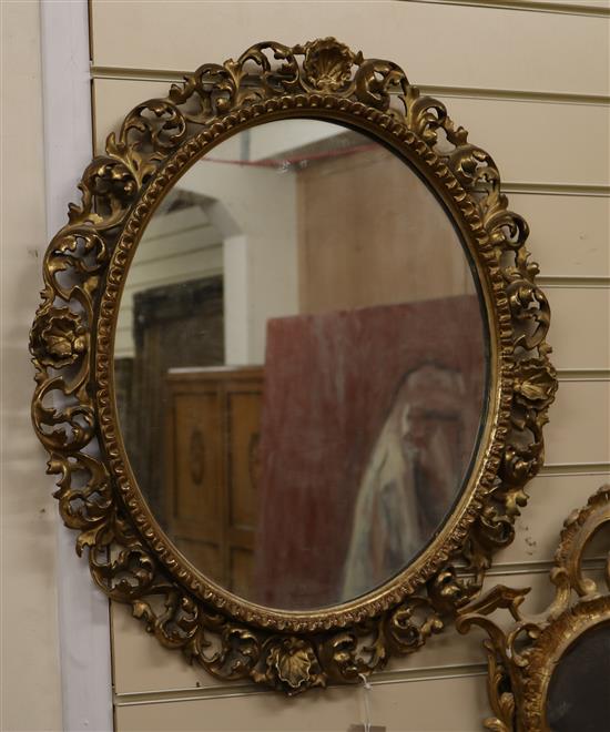 A Florentine carved gilt wood oval mirror W.50cm
